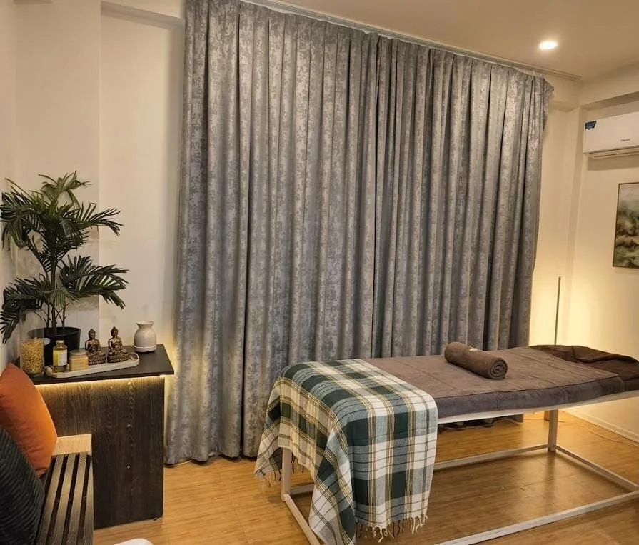 Treatment room with draped curtains at The Sidra Spa
